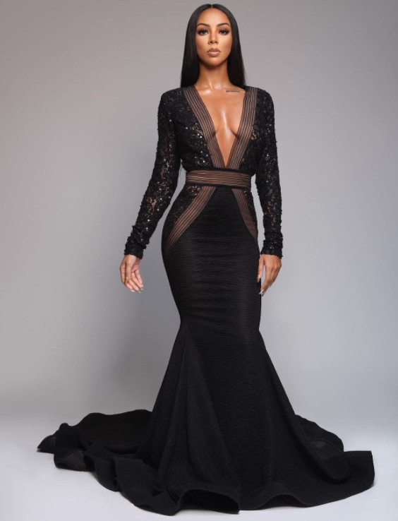Brittany renner posing in black gown