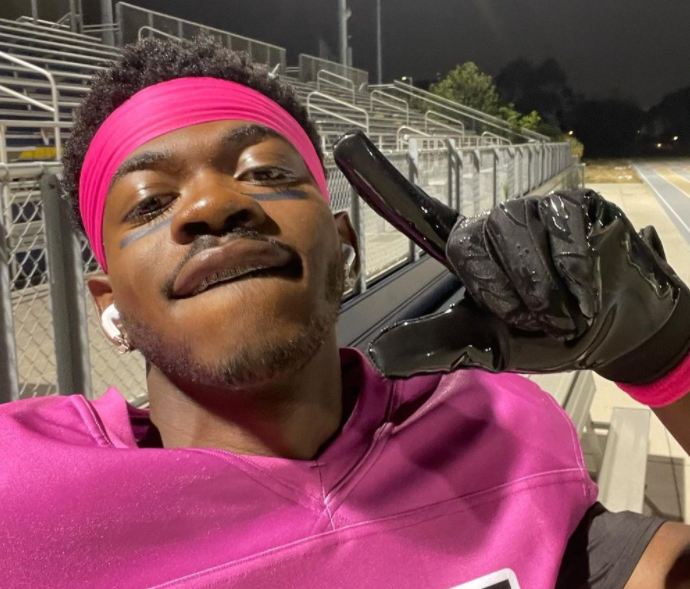 Lil nas X clicking selfie at the stadium
