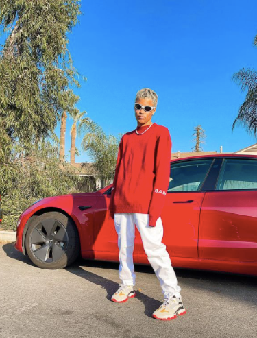 edwin joel infront of his car