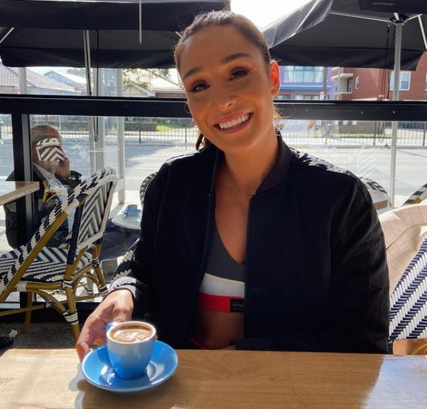 Kayla itsines having coffee in a cafe