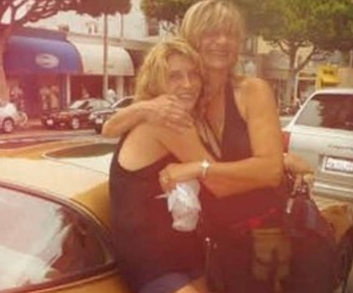 kesha posing with her mom in a car